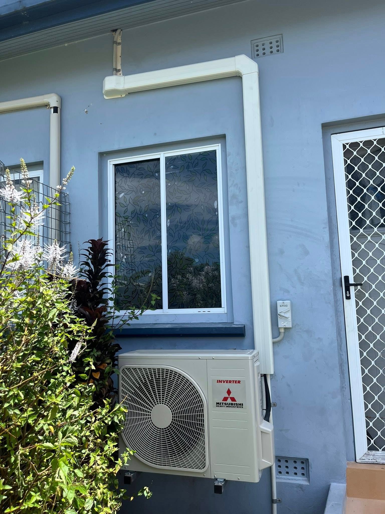Outdoor Wall With Window and Air-conditioning Unit — Topspark Electrical FNQ in Atherton, QLD