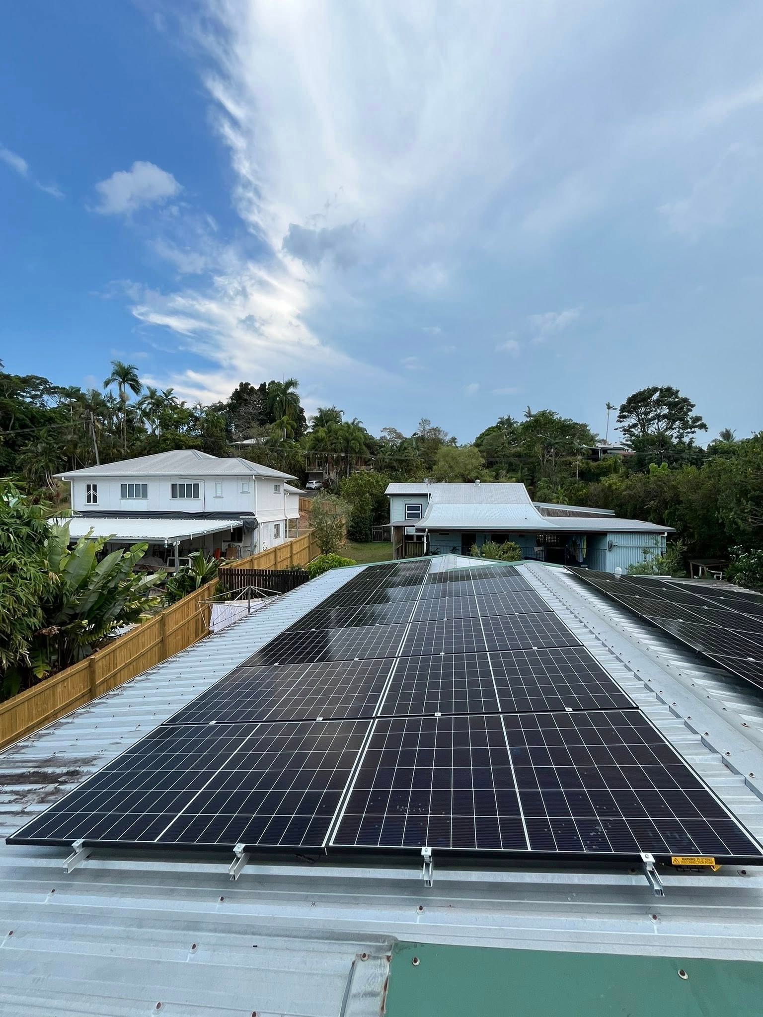 Large Rooftop Solar Panel Array Under a Blue Sky — Topspark Electrical FNQ in Mareeba, QLD