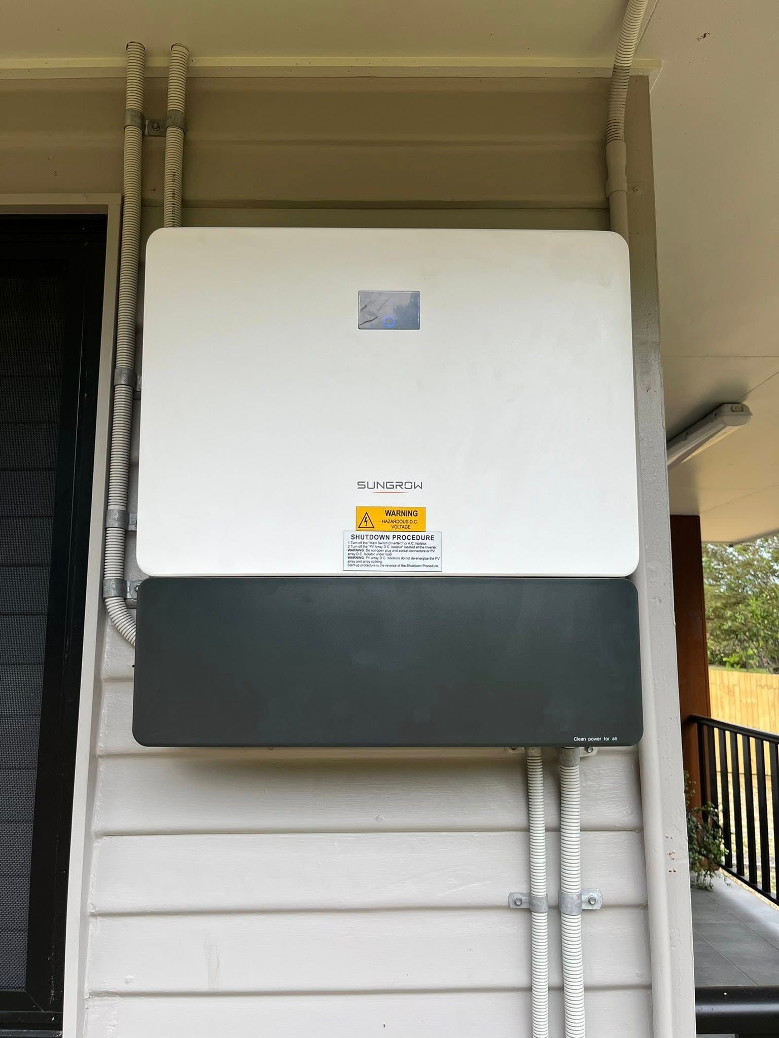 Wall-mounted White and Gray Electrical Unit With Conduit — Topspark Electrical FNQ in Atherton, QLD