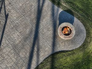 An aerial view of a fire pit on a patio.