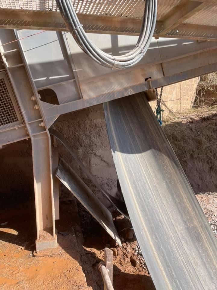 A Metal Structure with A Conveyor Belt Going Down It — Conveyor Maintenance Services In Ayr, QLD