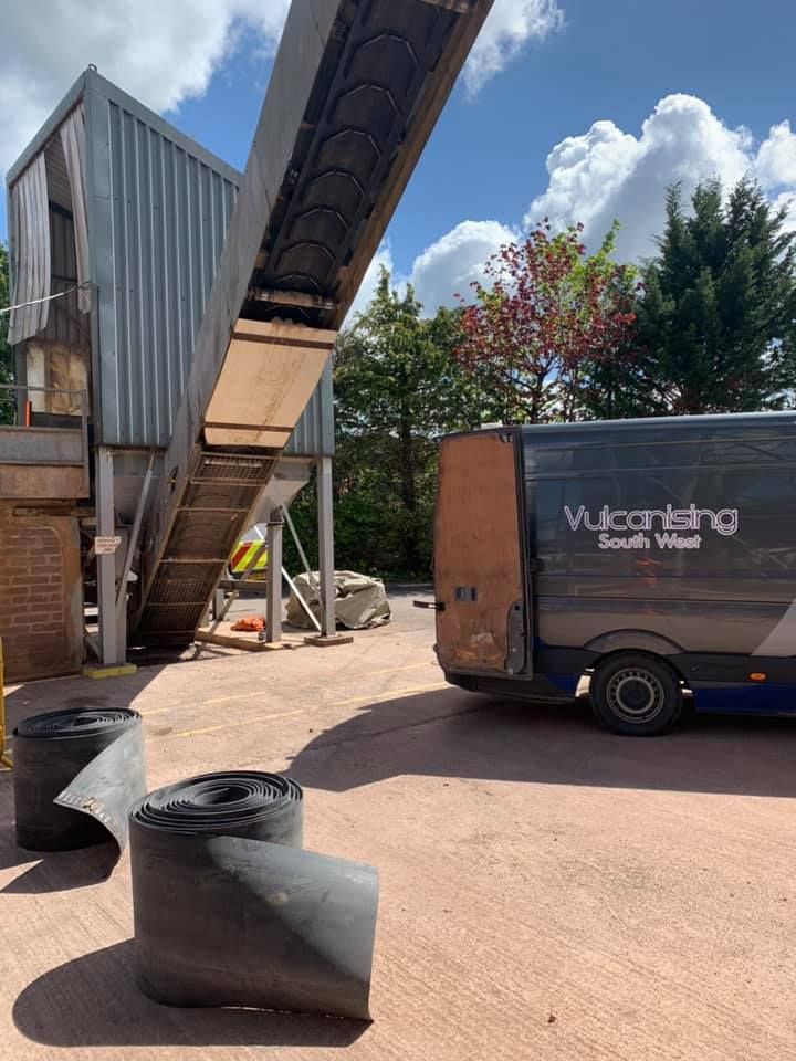 Two Big Rolled Rubber Belts On The Floor — Conveyor Maintenance Services In Bohle, QLD