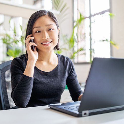 A woman on the phone discussing virtual mail services