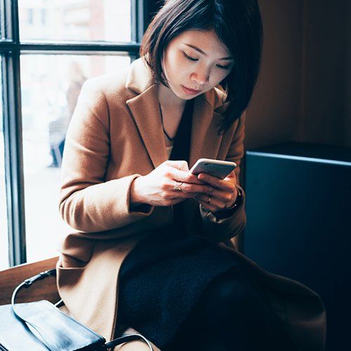 Woman Using Mobile Phone — Chicago, IL — Mail Center Of Chicago Inc Woman Using Mobile Phone — Chicago, IL — Mail Center Of Chicago Inc
