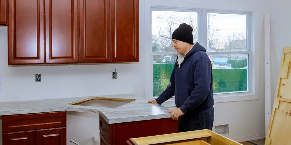 Man Setting Tiles — St. Paul, MN  — APEX Design Build