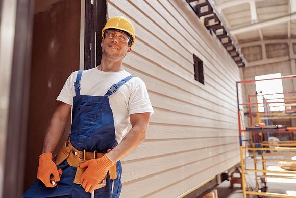 worker leaning beside the container