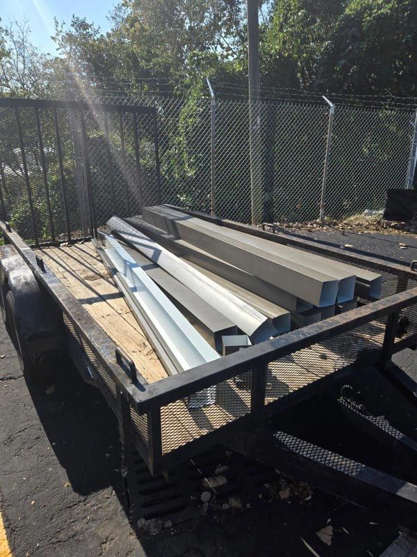 A trailer with a bunch of gutters on it