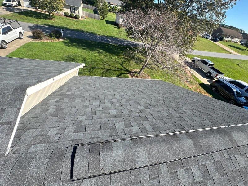 An aerial view of a roof in a residential area.
