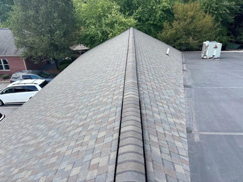 The roof of a building with a lot of shingles on it.