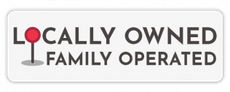 A white sign that says locally owned family operated