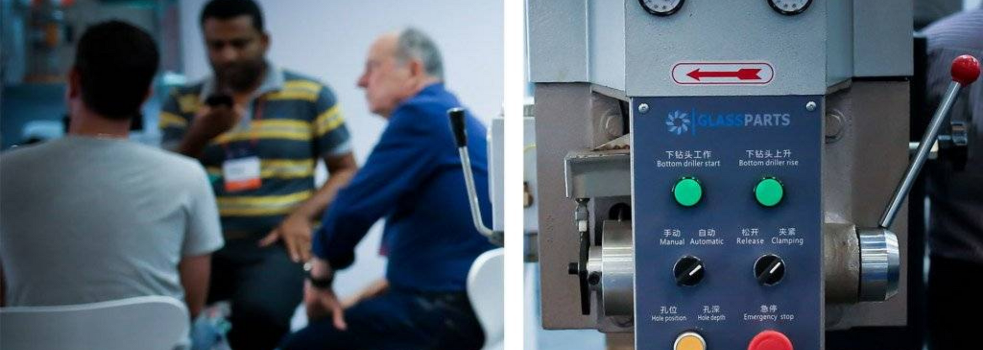 People gathered near a control panel with green and red buttons. A machine with a red handle is on the right.