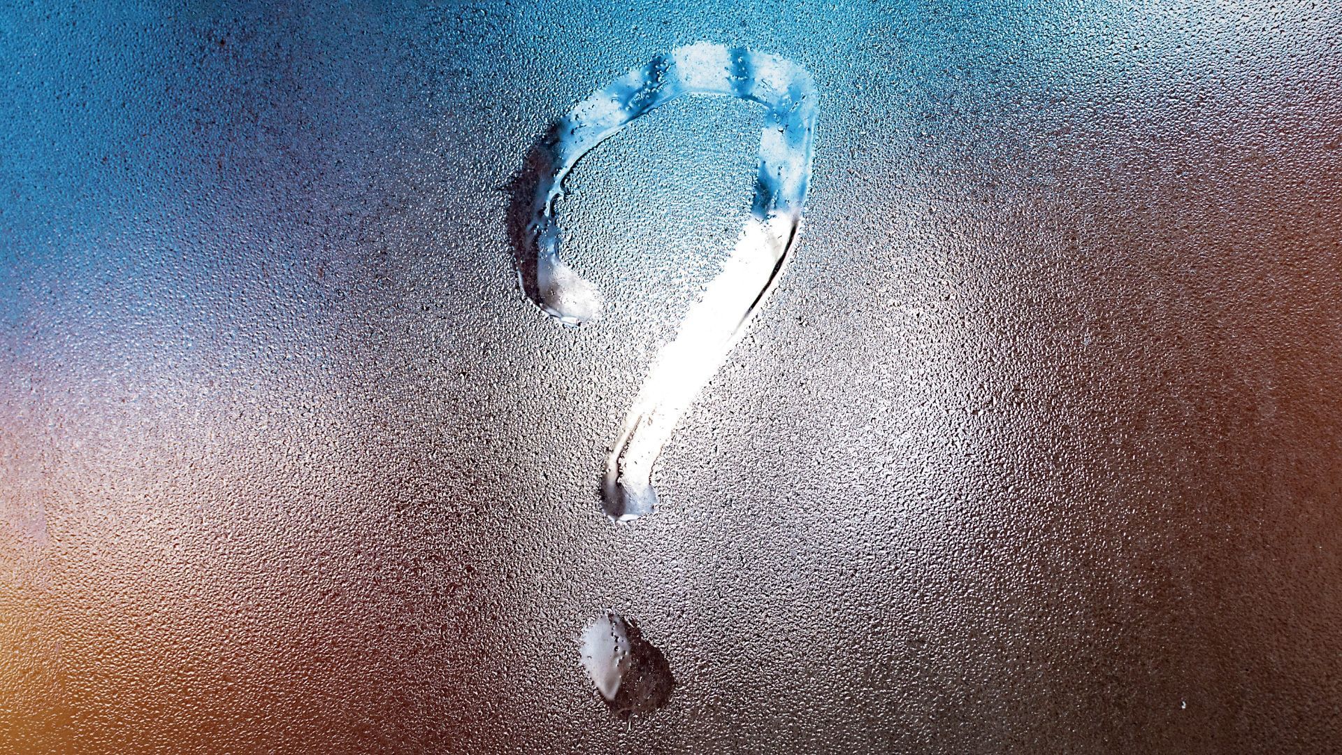 Question mark drawn in condensation on a glass surface, with blue and brown gradients.