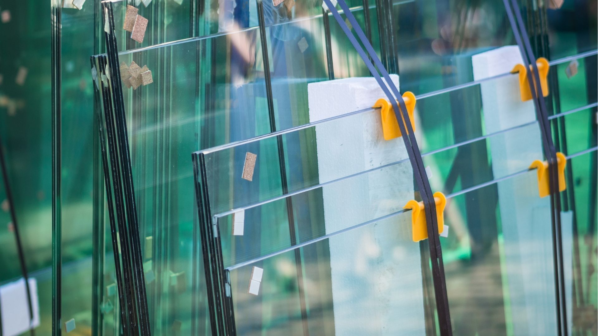 Glass panes held in place with clamps, possibly during construction or inspection.