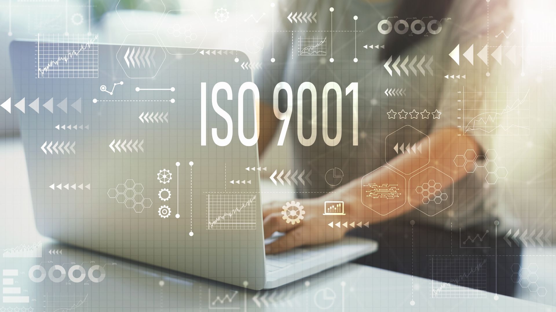 Person typing on a laptop with the text 