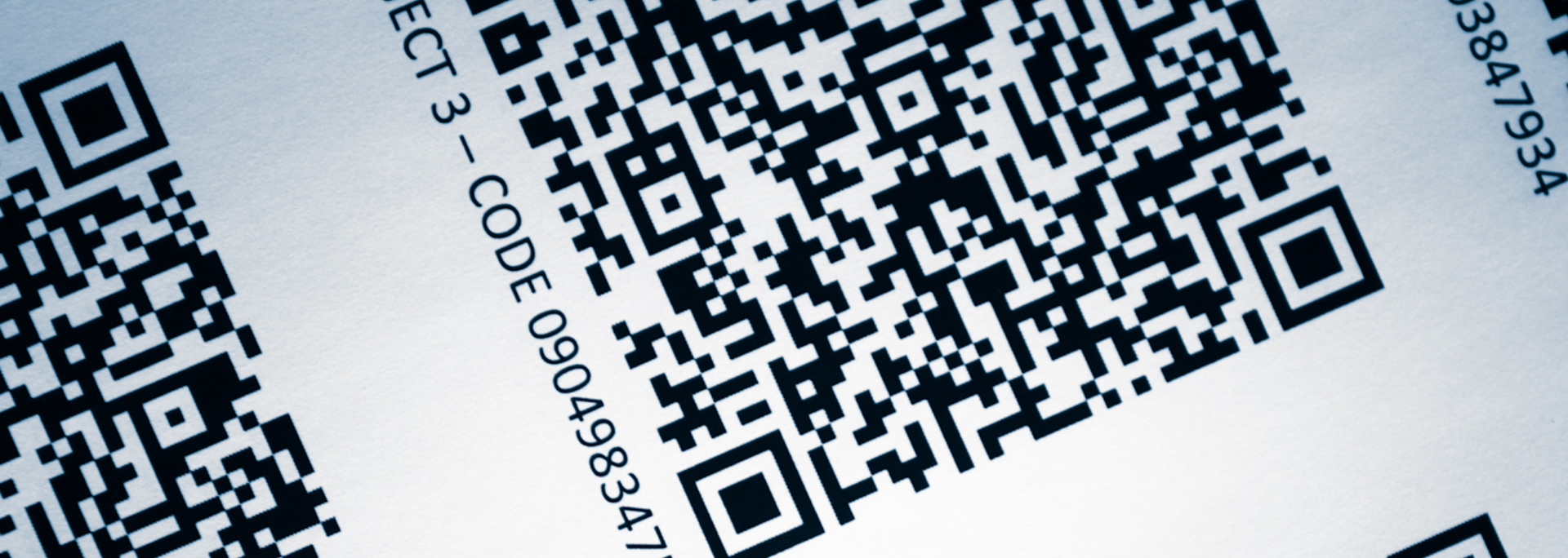 QR codes on a white surface, with text 