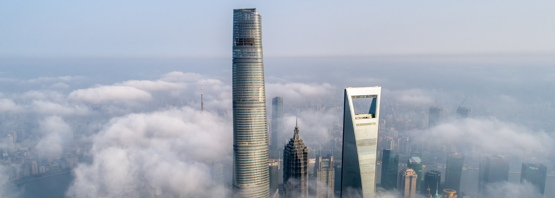 Skyscrapers emerging from a sea of clouds in Shanghai, China.