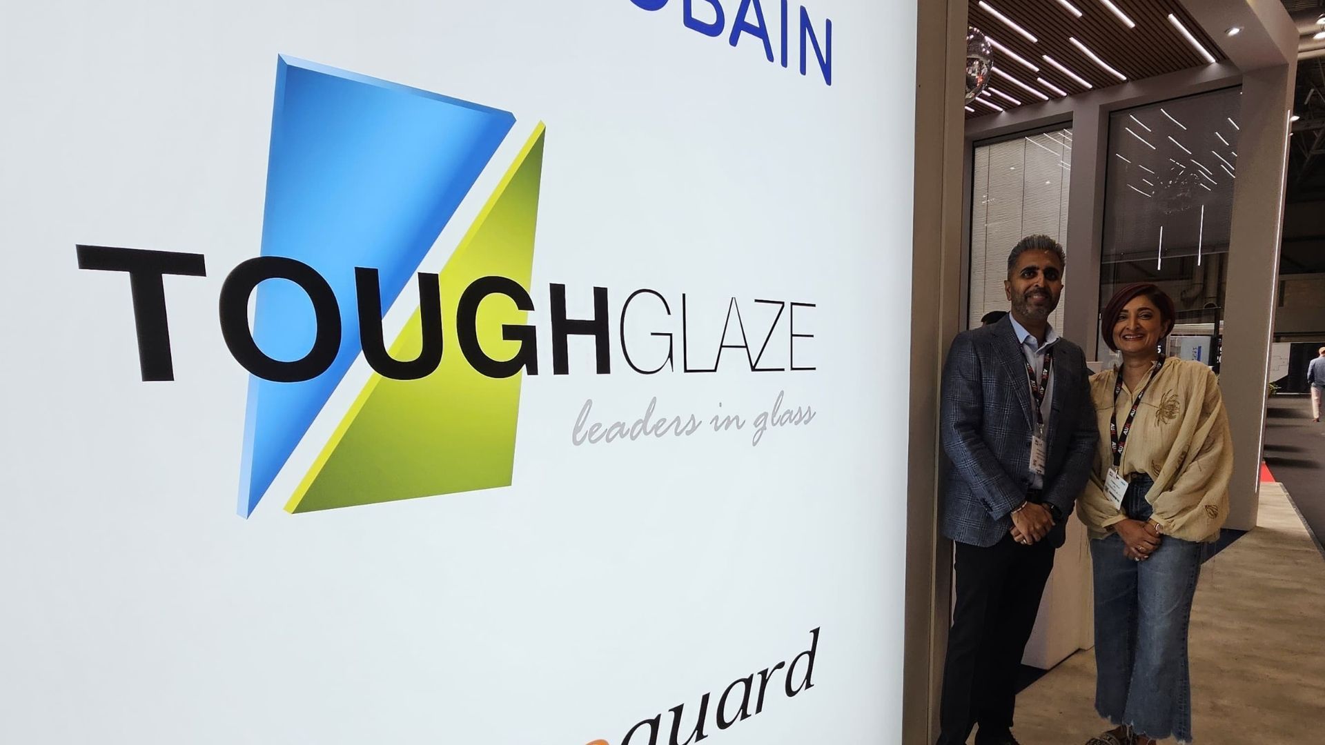 Two people stand next to a 