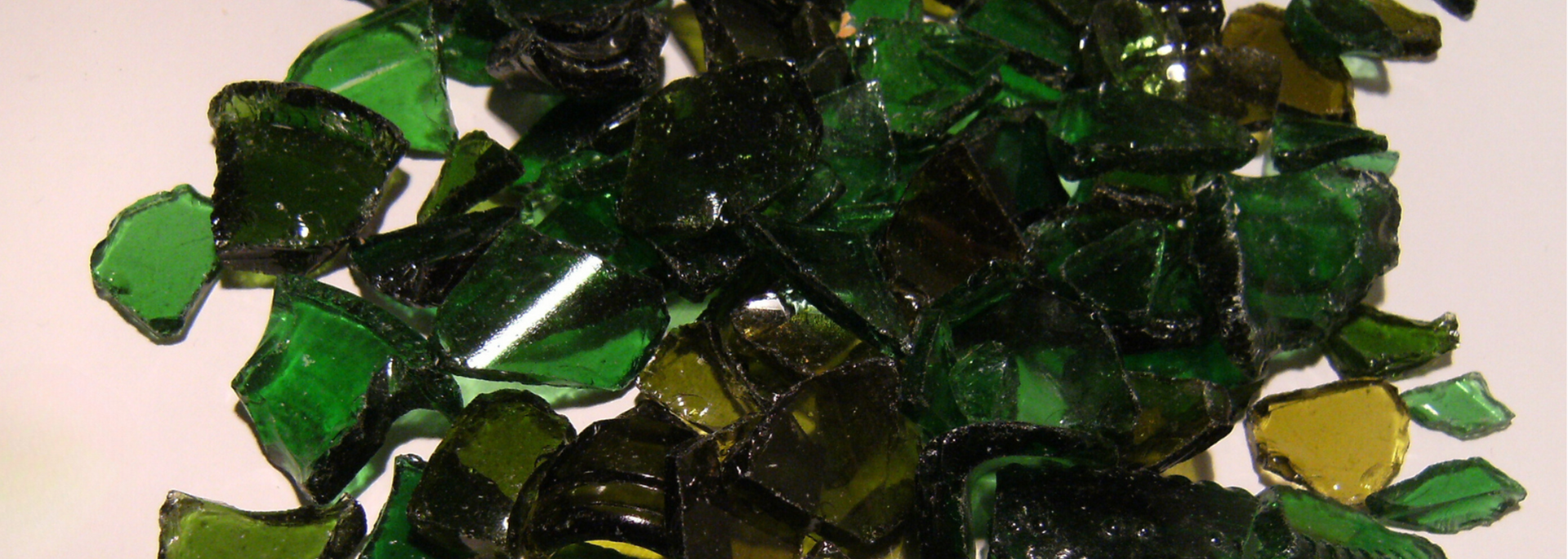 Scattered pieces of dark green glass.