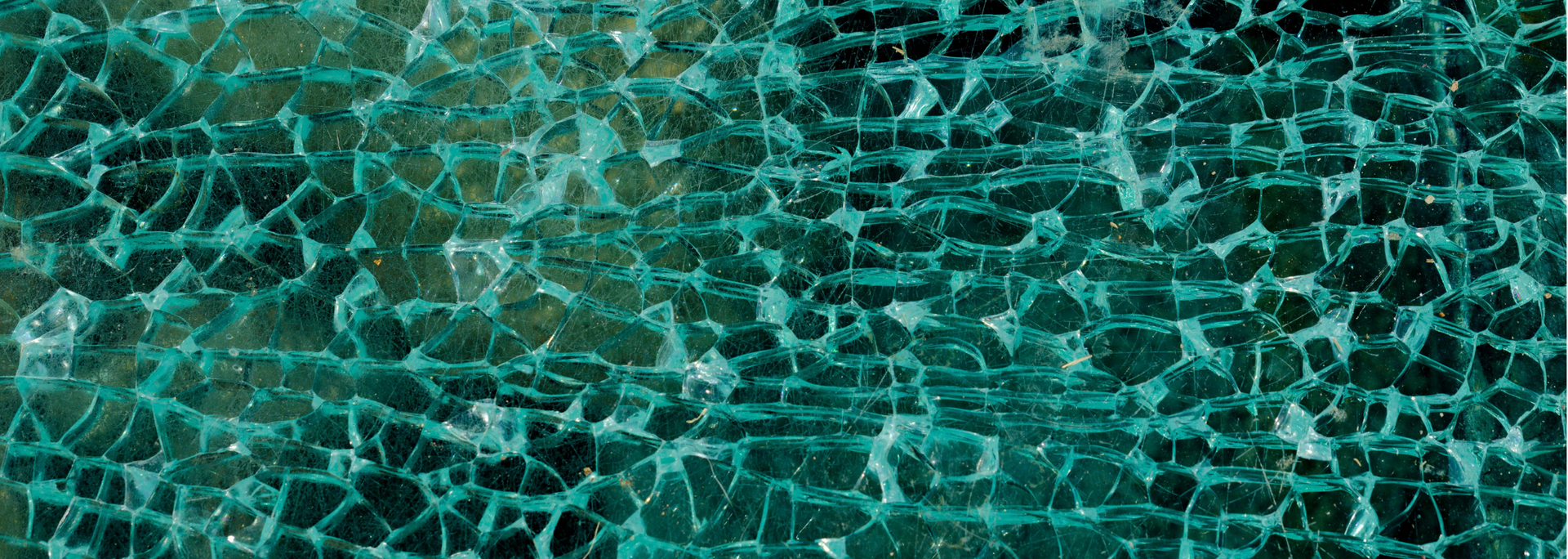 Cracked, teal-colored glass.