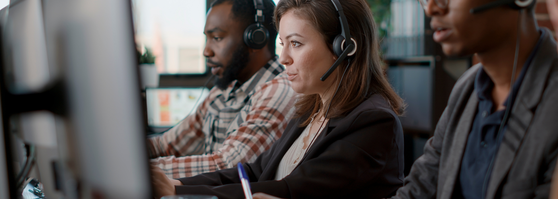 Picture of people working at a call centre. 