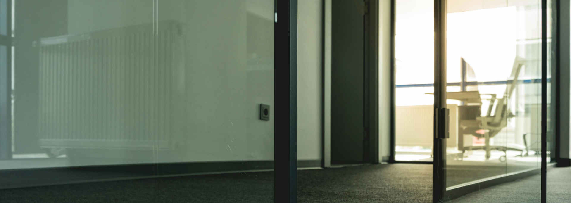 Picture of a glass door with a metal frame.