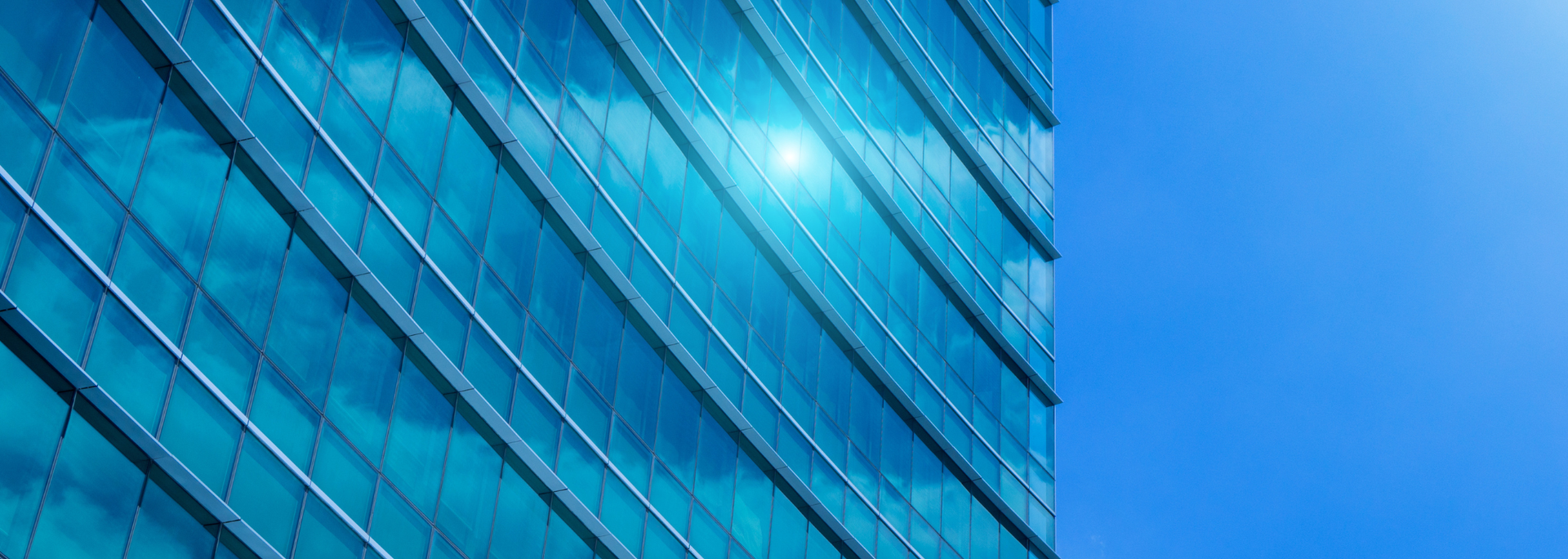 Picture of glass in a building facade under heavy sunlight. Picture of glass in a building facade under heavy sunlight.