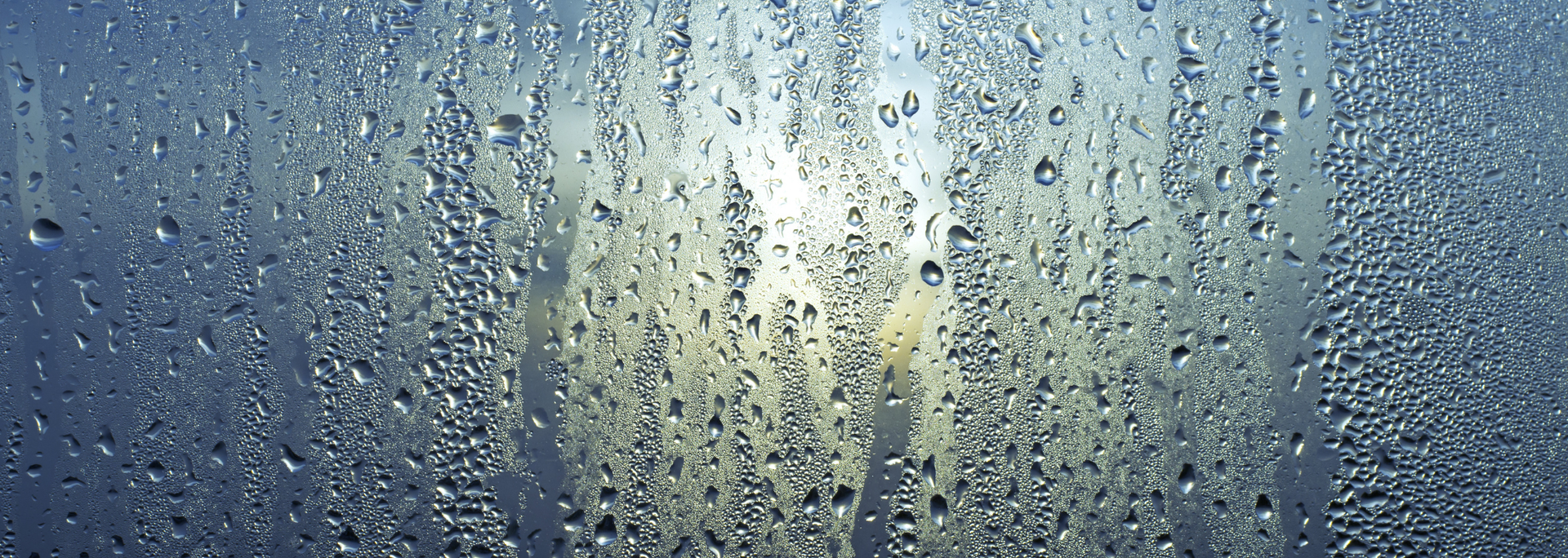 Picture of water  running down a window.