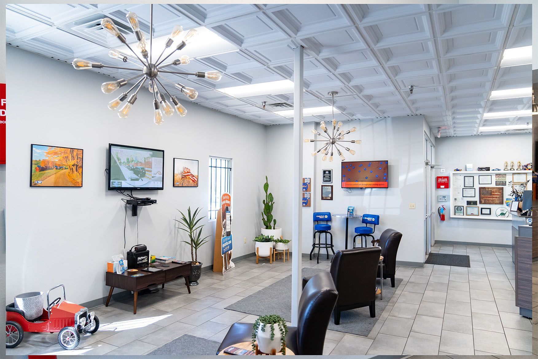 A large room with a lot of furniture and a television on the wall. | Zia Automotive