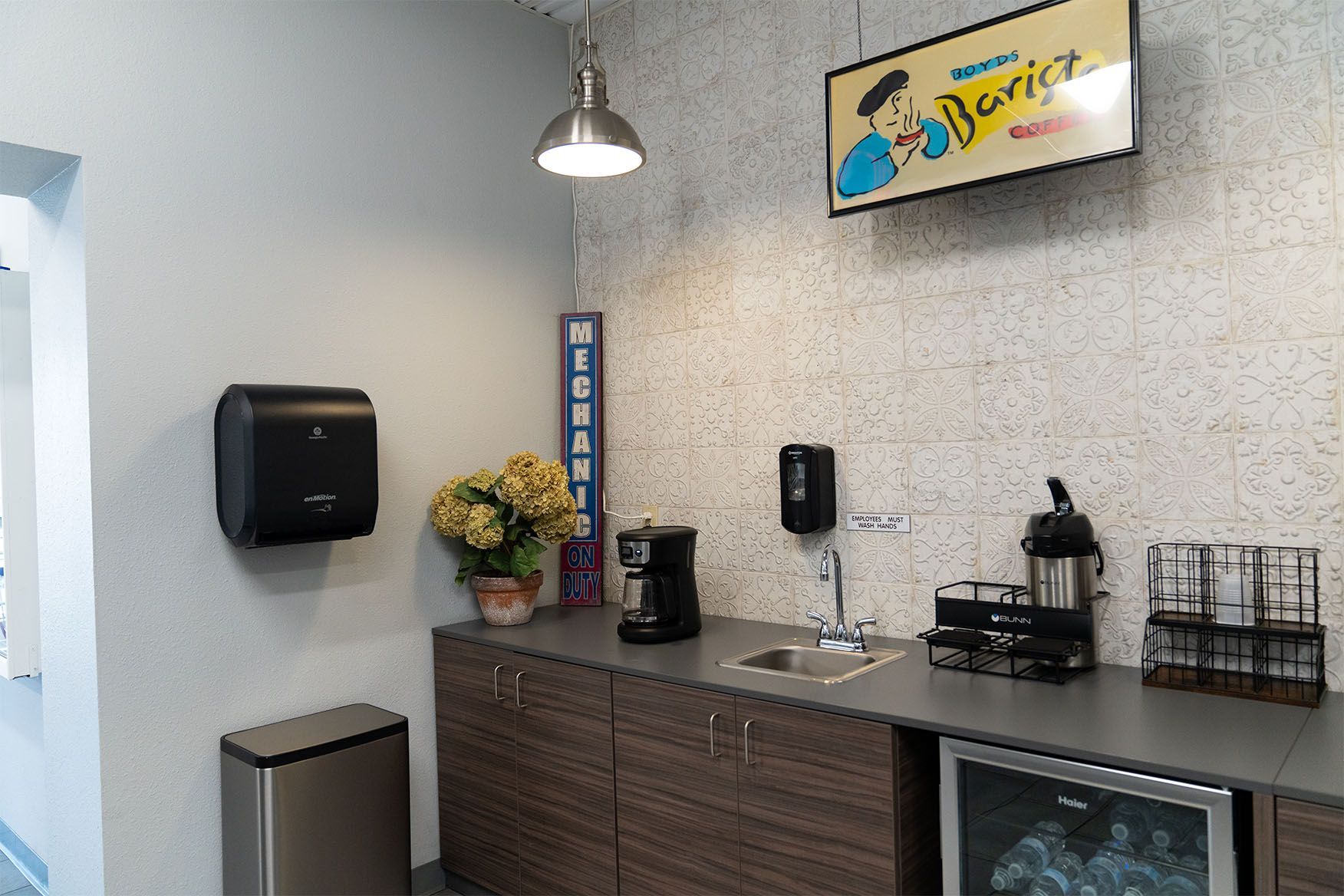 A kitchen with a sign on the wall that says berice | Zia Automotive