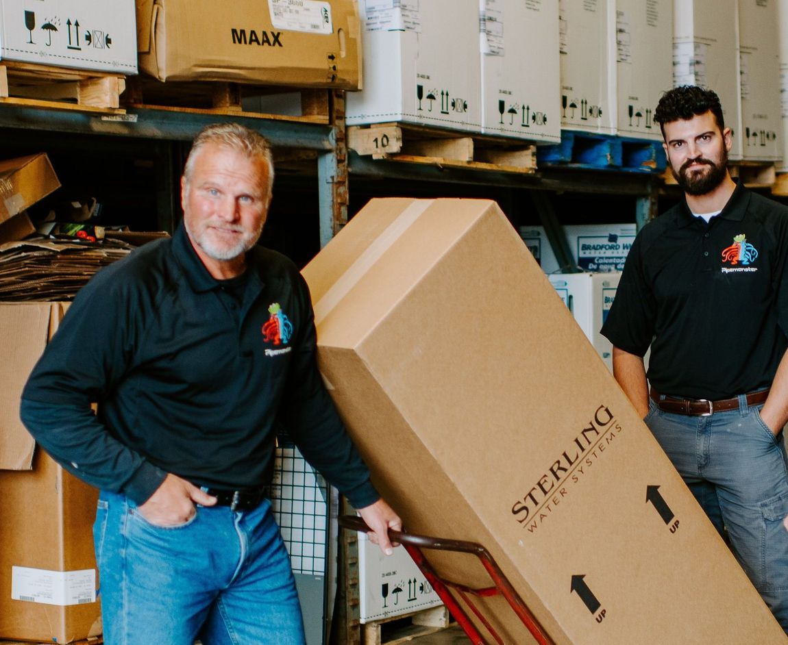 Two men standing next to a large sterling box