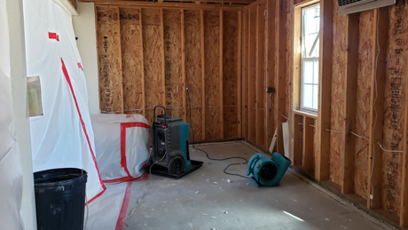 A room with a lot of wooden walls and a window.