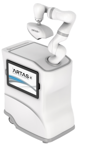 A robotic arm is attached to a machine that says ' arta ' on it