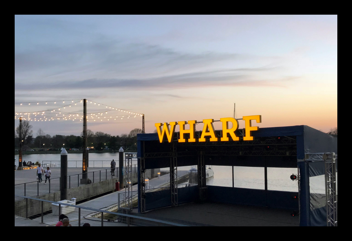 The word wharf is on a building overlooking a body of water