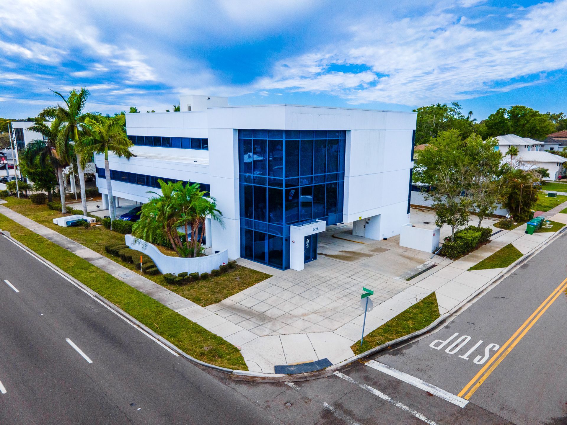 An aerial view of a building with a stop sign in front of it