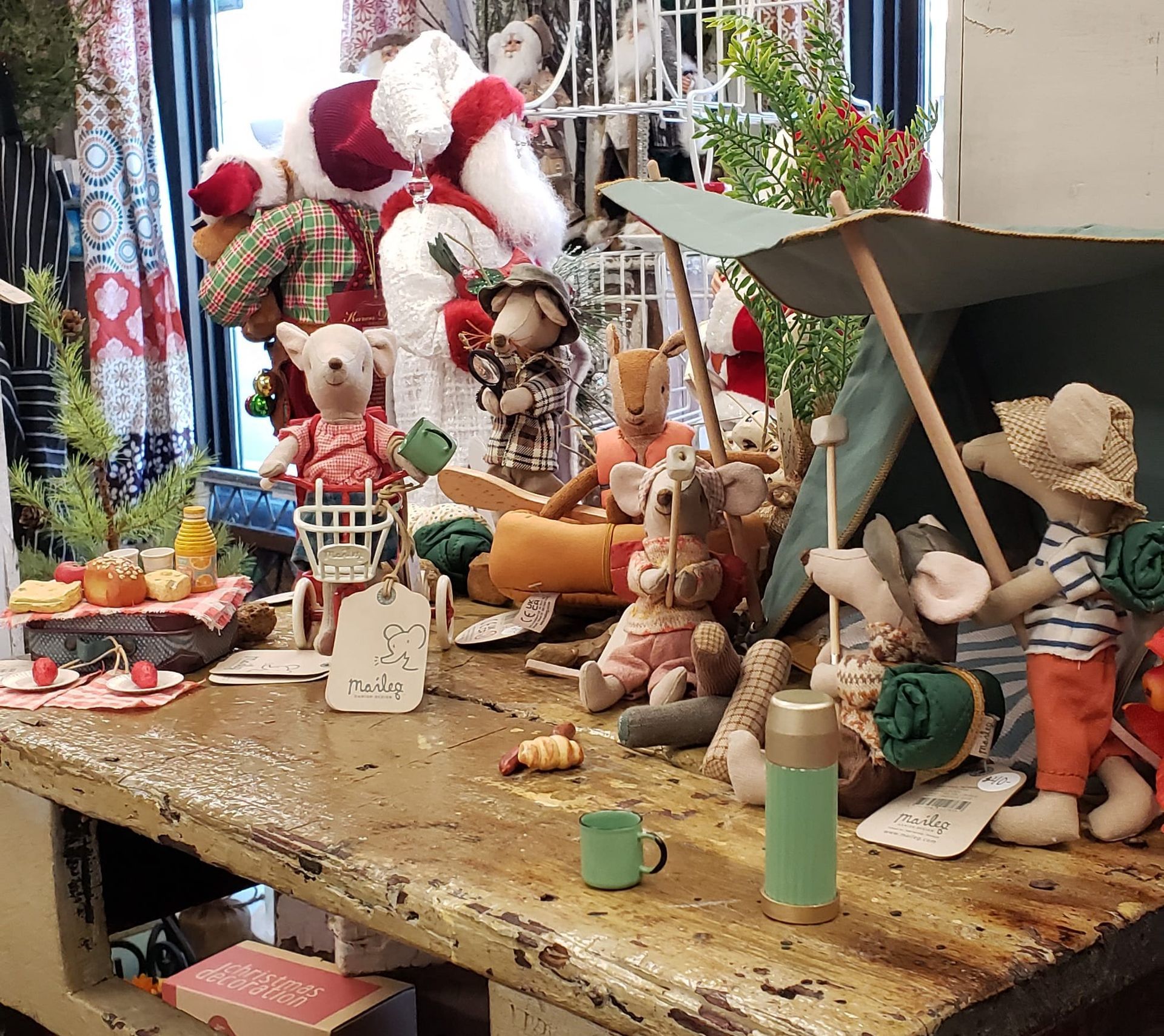 A bunch of stuffed animals are sitting on a table