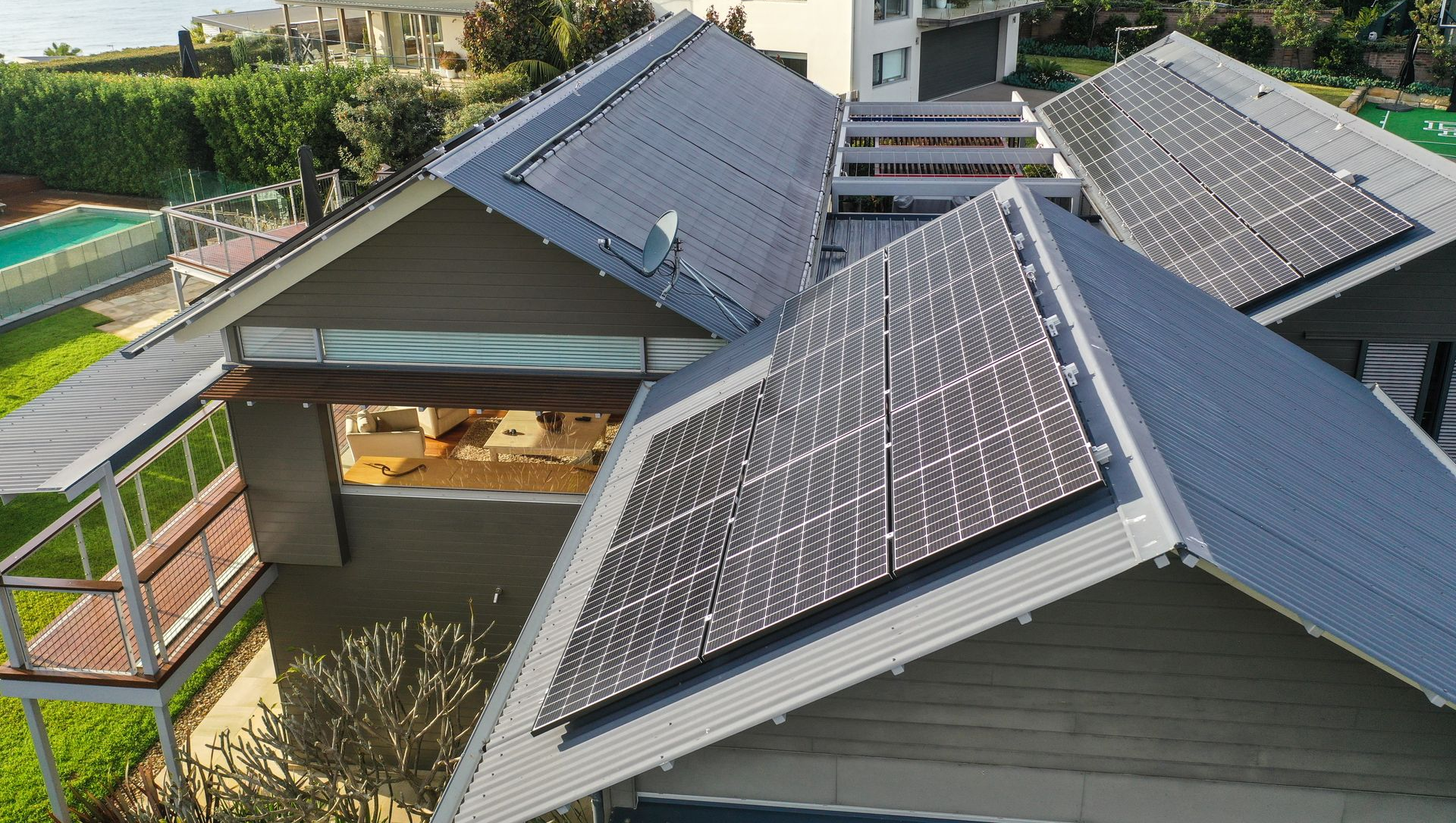 House roofs with solar panels in a residential neighborhood