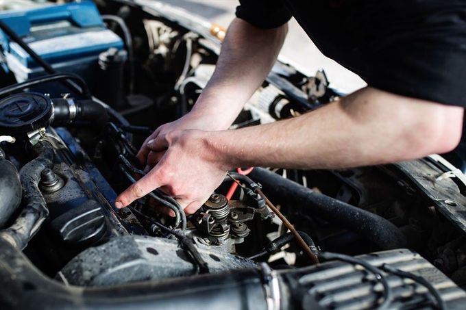 A Ballina mechanic servicing a car engine