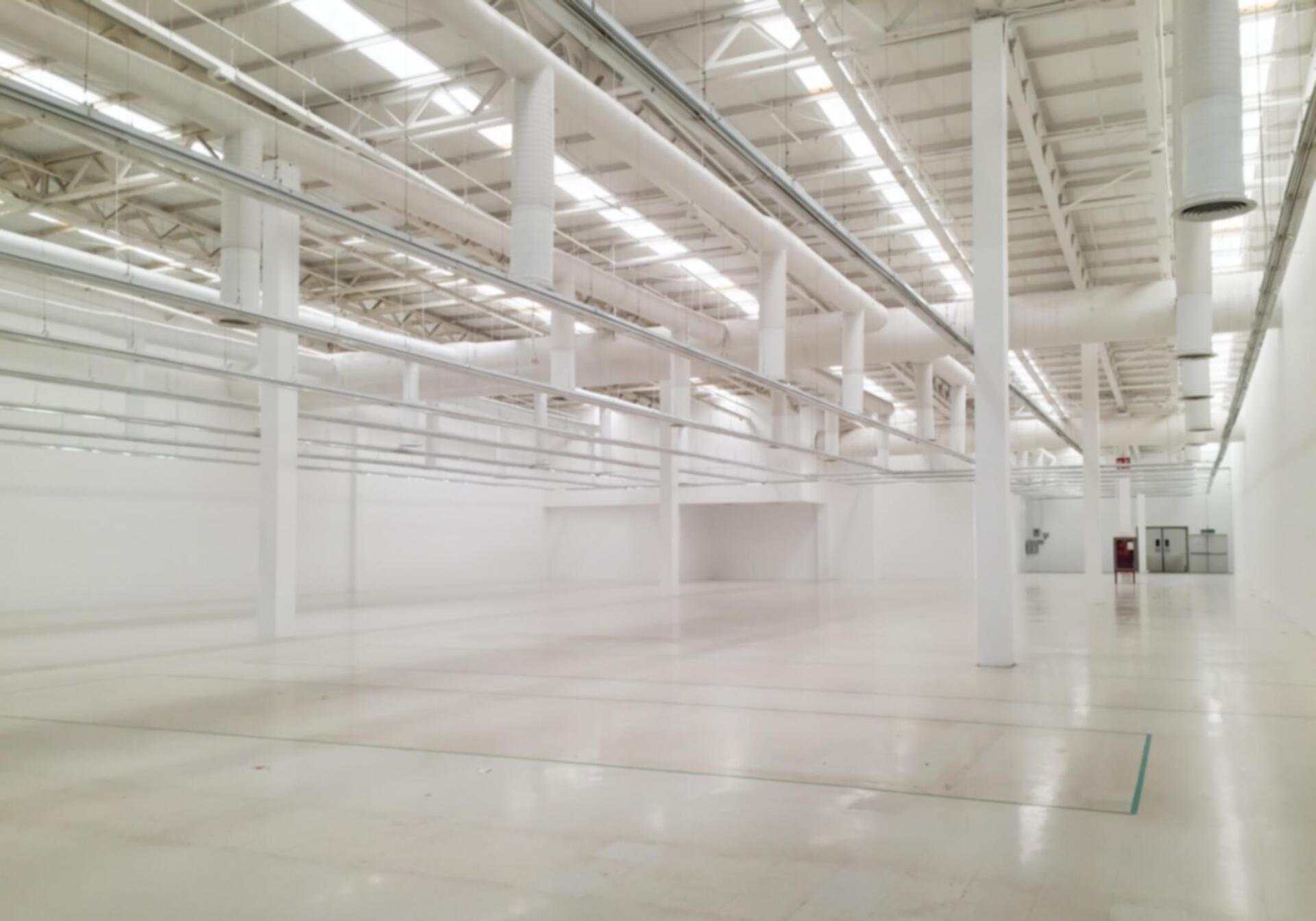 empty warehouse with white walls