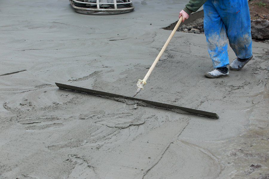 worker flattens the cement