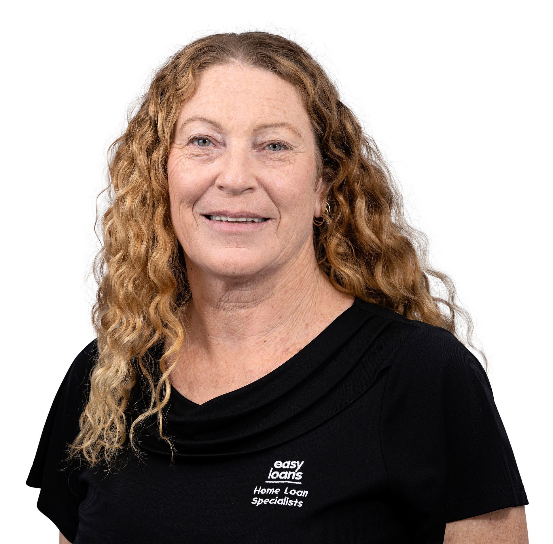 A woman wearing a black shirt and a necklace is smiling for the camera.