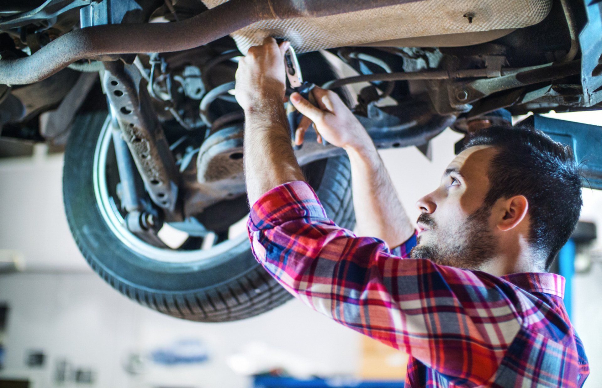 Man Repairing Car Brakes — Waxahachie, TX — Walton’s Total Car Care
