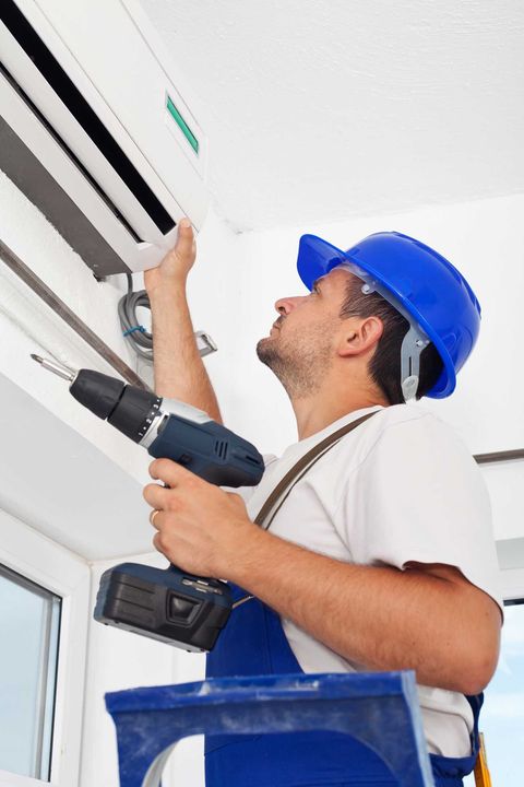 Man Working on Air Conditioning - Air Conditioning Maintenance in East Maitland, NSW