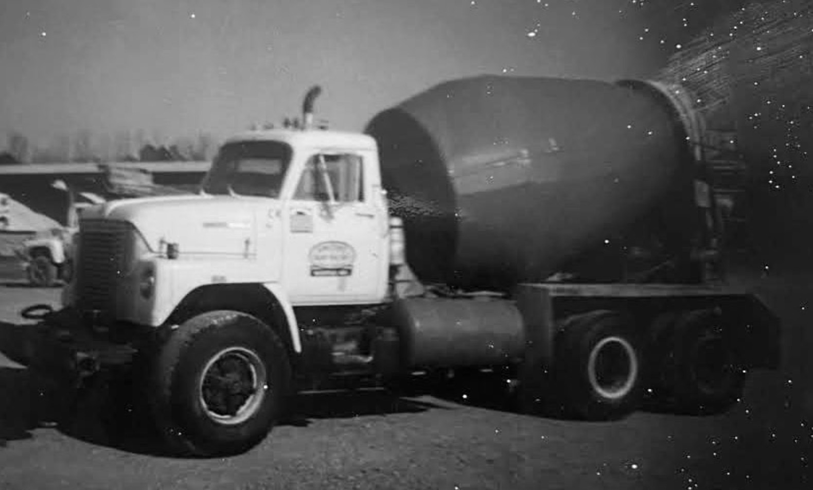 Cement truck parked outside, ready to pour concrete.