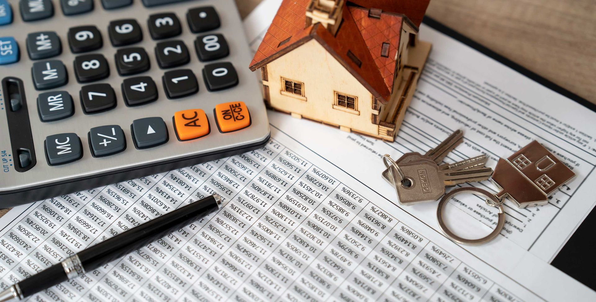 Money, pile of coins with a savings book and paper, symbolizing home loan mortgage rates. Money, pile of coins with a savings book and paper, symbolizing home loan mortgage rates.