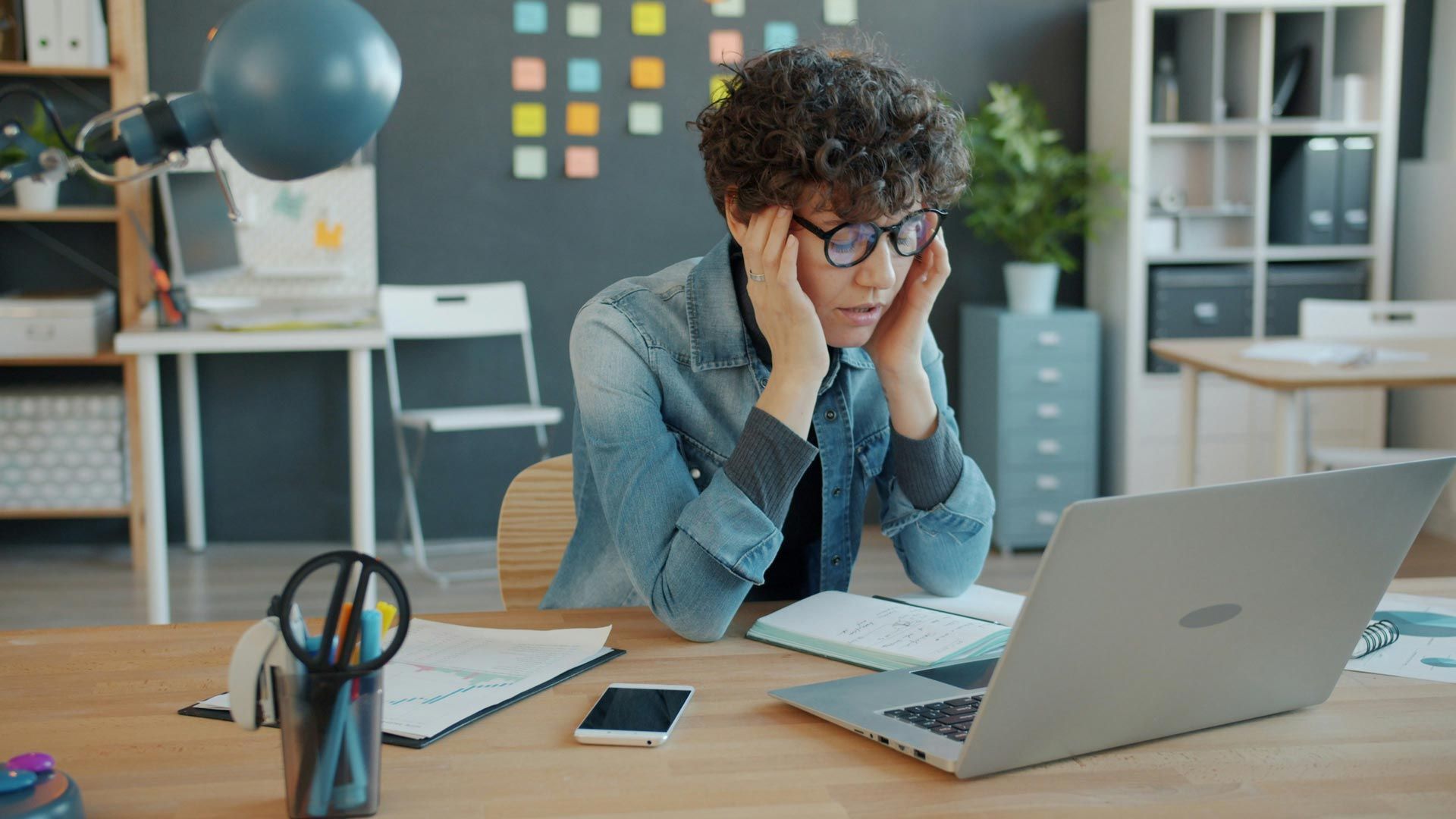 Job seeker reviewing automated job applications while networking remains the key to securing intervi