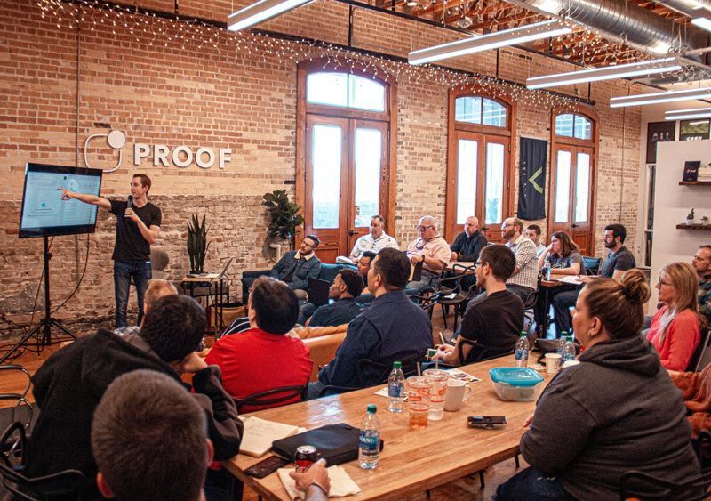 Members of a professional organization meeting at its monthly networking event.