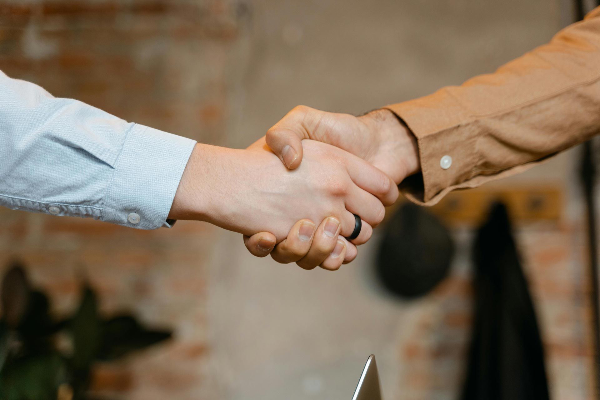 Two professionals shaking hands after a job interview.