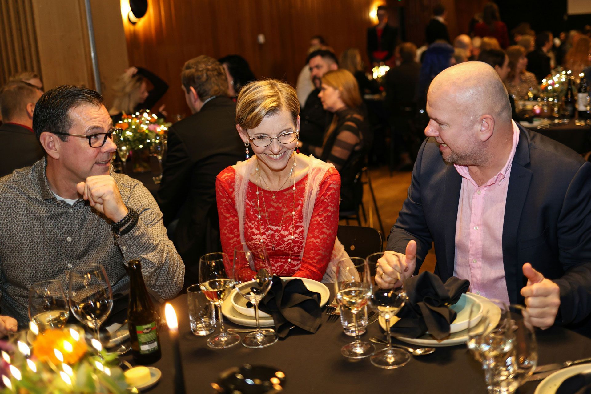 executive job seeker talking to two potential contacts at a company that is hiring