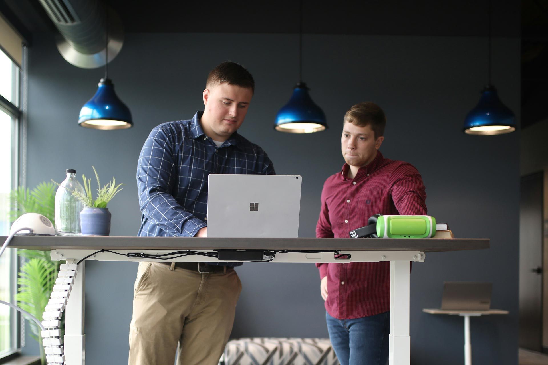 younger executive watching an older executive put together a report during a preceptorship