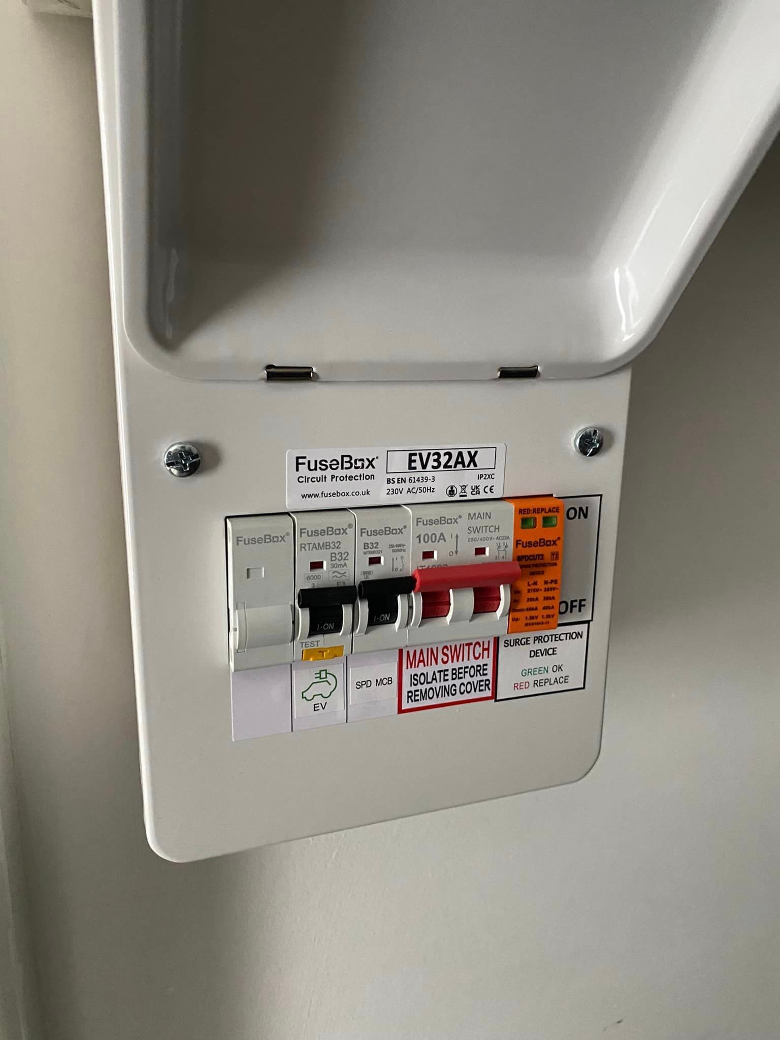 A close up of a electrical box on a wall.